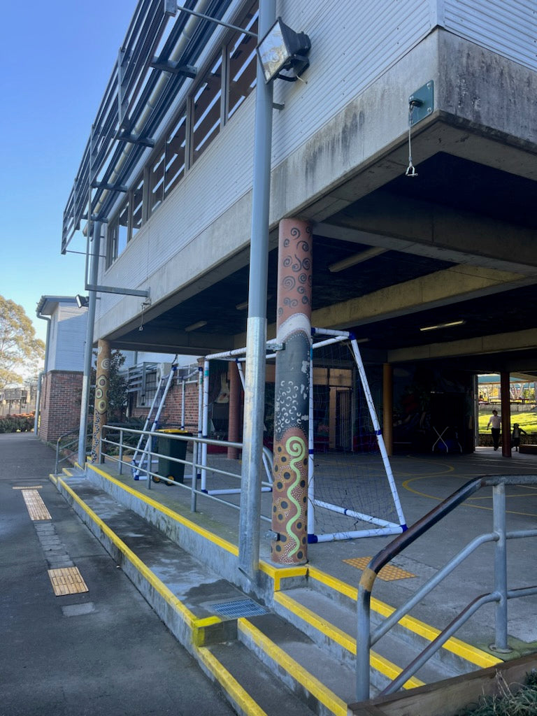 downpipe shrouds on school building